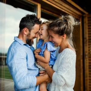 Parents and baby smiling after discussing flexible financing options