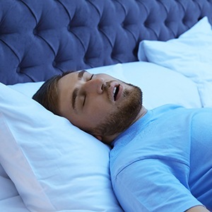 a man with sleep apnea resting in bed in Tulsa