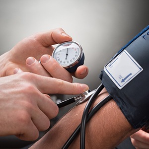 a person getting their blood pressure tested in Tulsa