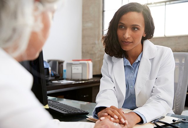 Woman speaking to a doctor