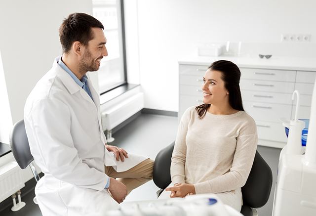 Woman talking to a dentist