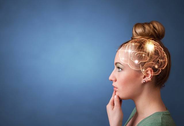 a woman thinking with imaginary image of her brain