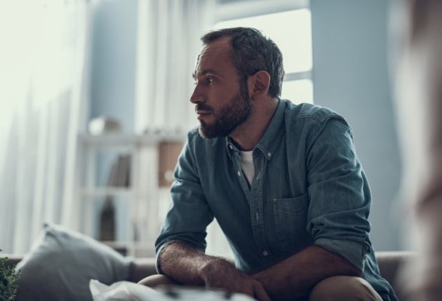 a man worried and not getting enough sleep