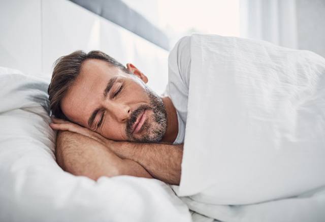 a person wearing a CPAP face mask for sleep apnea 