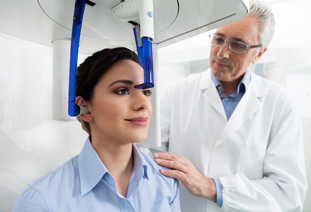 A patient preparing for a CBCT scan in Tulsa