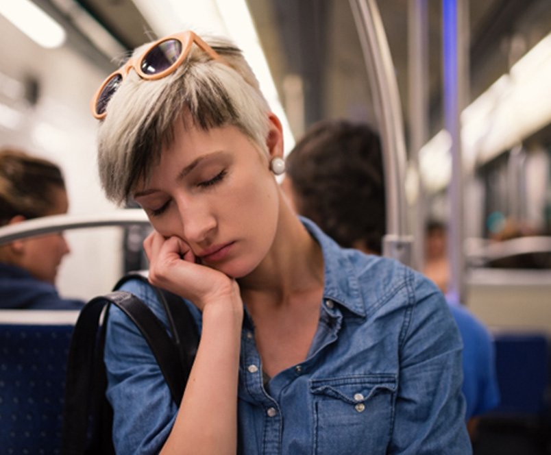 Woman sleeping on a train