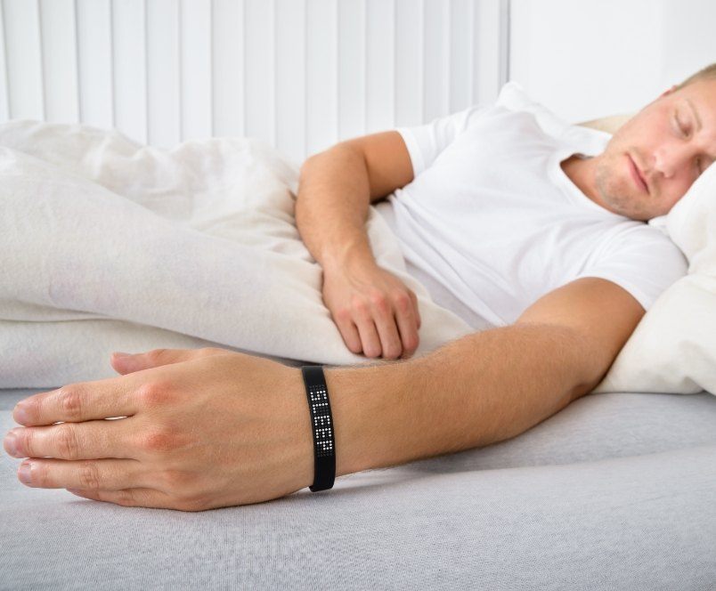 Man sleeping soundly thanks to sleep apnea therapy with custom oral appliances
